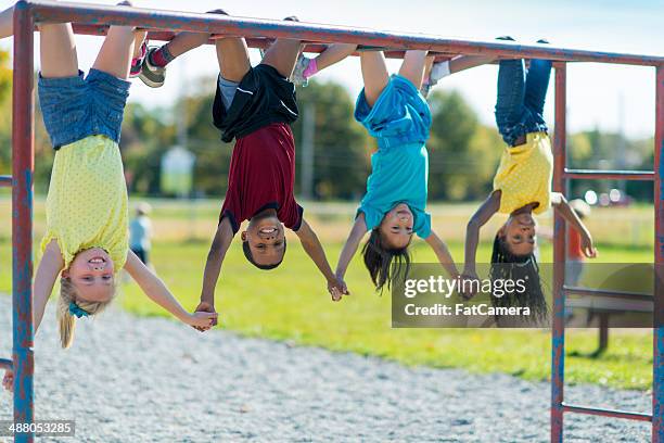 recess - boy on monkey bars stock pictures, royalty-free photos & images
