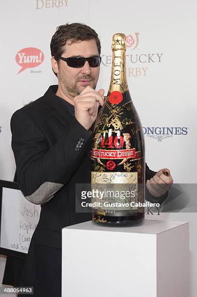 Phil Hellmuth toasts with Moet & Chandon at the 140th Kentucky Derby at Churchill Downs on May 3, 2014 in Louisville, Kentucky.