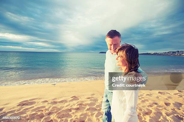 happy mature couple looking at the sunrise - 2015 45 50 stock pictures, royalty-free photos & images