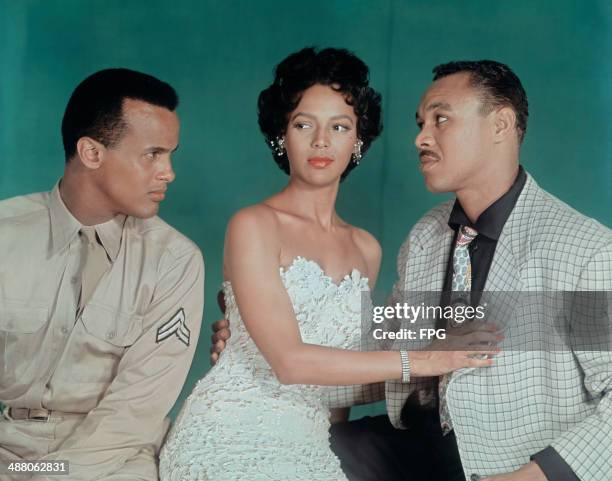 American actress Dorothy Dandridge with actors Harry Belafonte and Joe Adams in a publicity still from the film 'Carmen Jones', 1954.