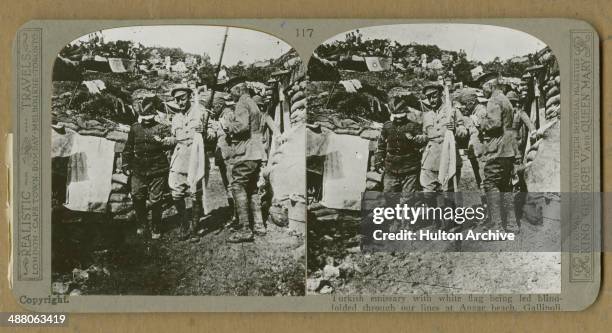 Stereoscopic image of Australian, Major Sam Butler of the Australian and New Zealand Army Corps , carrying a white flag and leading a blindfolded...
