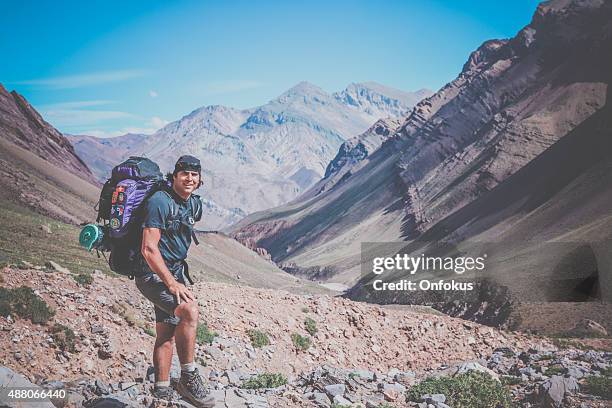 man hiker with backpack in aconcagua valley, argentina - mount aconcagua stock pictures, royalty-free photos & images