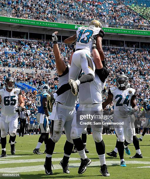 Rashad Greene of the Jacksonville Jaguars celebrates after scoring a touchdown during the game against the Carolina Panthers at EverBank Field on...