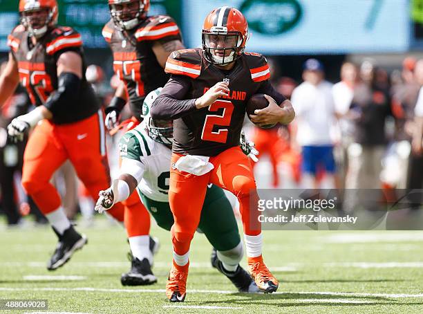 Johnny Manziel of the Cleveland Browns scrambles against the New York Jets during the game at MetLife Stadium on September 13, 2015 in East...