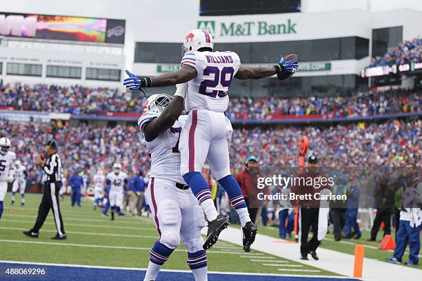 Karlos Williams of the Buffalo Bills celebrates his touchdown against the Indianapolis Colts with John Miller of the Buffalo Bills during the first...