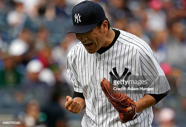 Masahiro Tanaka of the New York Yankees reacts after the final out in the seventh inning against the Toronto Blue Jays at Yankee Stadium on September...