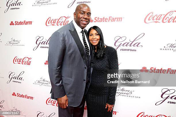 Earvin "Magic" Johnson and his wife Cookie Johnson attend the 2014 Steve & Marjorie Harvey Foundation Gala presented by Coca-Cola at the Hilton...