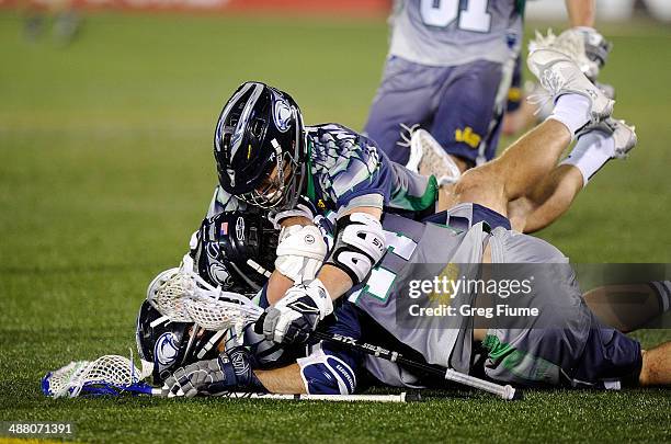 Stephen Peyser of the Chesapeake Bayhawks is mobbed by teammates after scoring the game winning goal in overtime against the New York Lizards at...