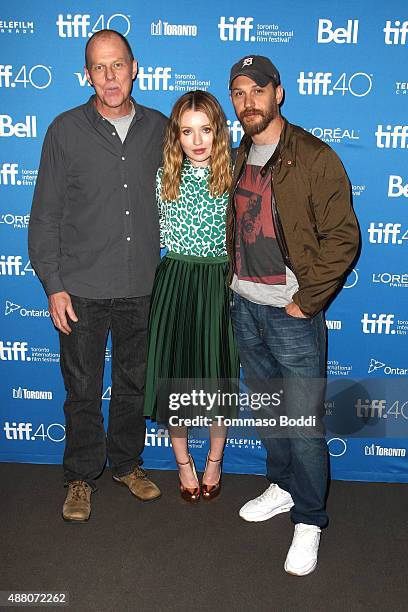 Writer/director Brian Helgeland, actress Emily Browning and actor Tom Hardy pose during the "Legend" press conference at the 2015 Toronto...