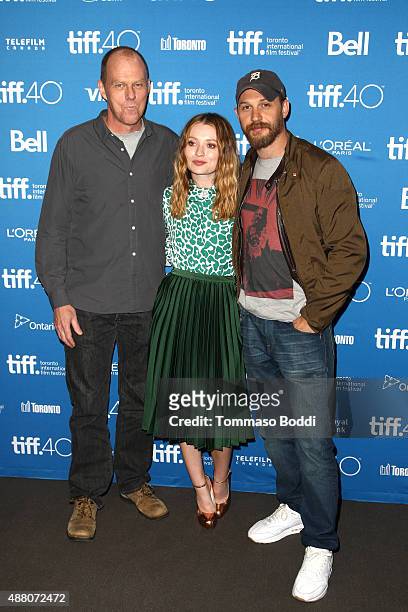 Writer/director Brian Helgeland, actress Emily Browning and actor Tom Hardy pose during the "Legend" press conference at the 2015 Toronto...