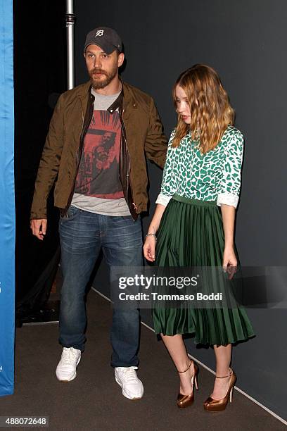 Actor Tom Hardy and actress Emily Browning pose during the "Legend" press conference at the 2015 Toronto International Film Festival at TIFF Bell...