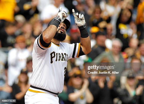 Pedro Alvarez of the Pittsburgh Pirates reacts after hitting a home run in the second inning during the game against the Milwaukee Brewers at PNC...