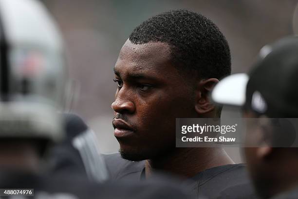 Aldon Smith of the Oakland Raiders warms up prior to playing the Cincinnati Bengals in their NFL season opener game at O.co Coliseum on September 13,...