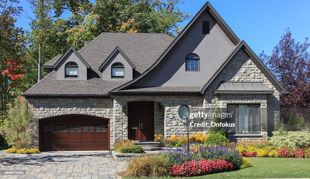 Luxury Suburban House Exterior in Summer