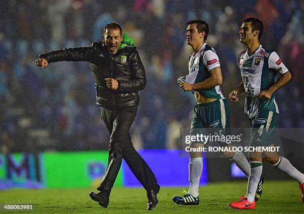 Leon's coach Gustavo Matosas , and players Juan Gonzalez and Rafael Marquez celebrate after the Mexican Clausura quarterfinal second leg football...