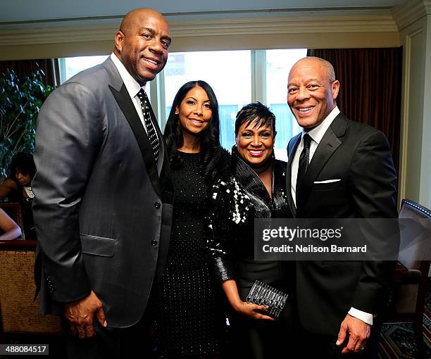 Earvin "Magic" Johnson and his wife Cookie Johnson and John Palmer and his wife Vicki Palmer attend the 2014 Steve & Marjorie Harvey Foundation Gala...