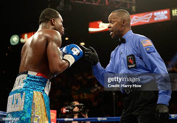 Adrien Broner is warned by the referee Kenny Bayless for flipping Carlos Molina during their super lightweight bout at the MGM Grand Garden Arena on...