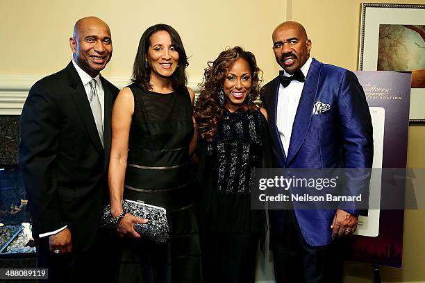 Luke and Kimberly Griffin of State Farm and Marjorie and Steve Harvey attend the 2014 Steve & Marjorie Harvey Foundation Gala presented by Coca-Cola...
