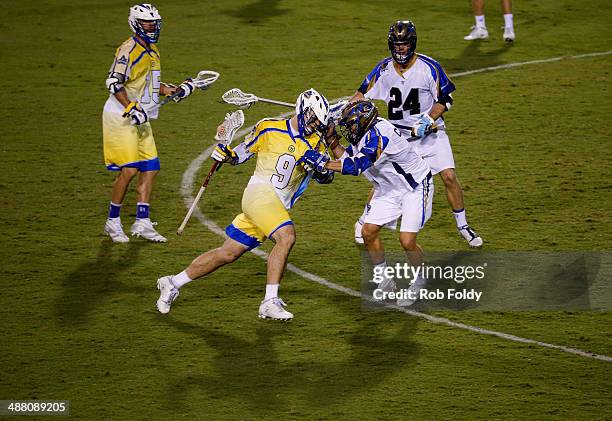 Garrett Thul of the Florida Launch is defended by Casey Cittadino of the Charlotte Hounds during the second half of the game at Florida Atlantic...