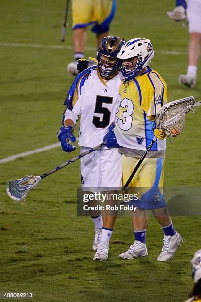 Brett Queener of the Florida Launch hugs Casey Cittadino of the Charlotte Hounds during the second half of the game at Florida Atlantic University...