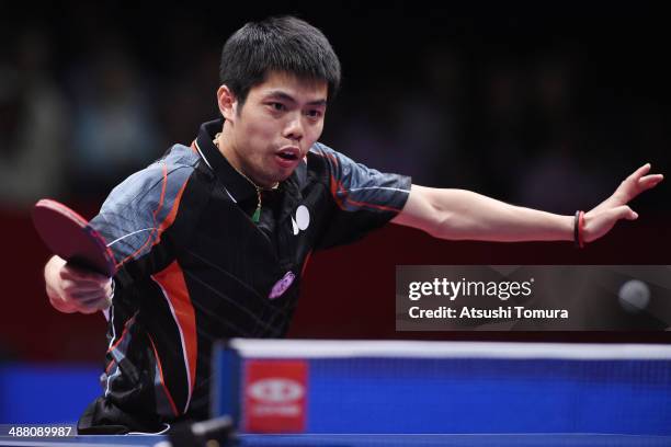 Chih-Yuan Chuang of Chinese Taipei plays a backhand against Long Ma of China during day seven of the 2014 World Team Table Tennis Championships at...