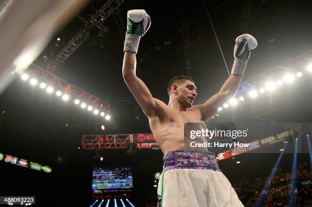 Amir Khan celebrates after the 12th round against Luis Collazo during their welterweight bout at the MGM Grand Garden Arena on May 3, 2014 in Las...