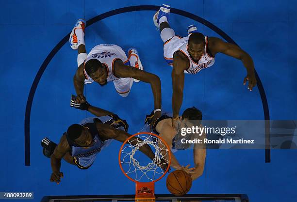 Kevin Durant and Serge Ibaka of the Oklahoma City Thunder battle with Tony Allen and Marc Gasol of the Memphis Grizzlies in Game Seven of the Western...