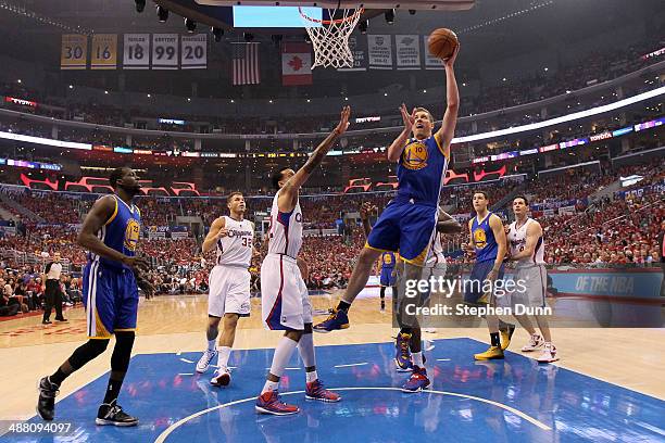 David Lee of the Golden State Warriors shoots over Matt Barnes of the Los Angeles Clippers in Game Seven of the Western Conference Quarterfinals...