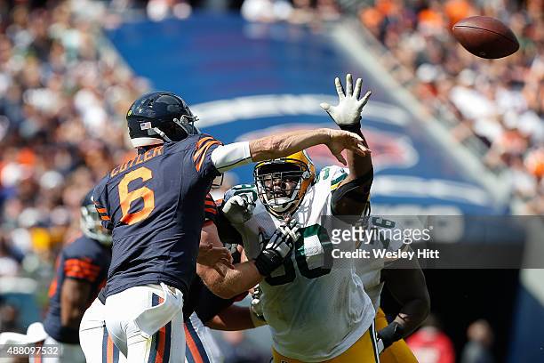 Raji of the Green Bay Packers charges at quarterback Jay Cutler of the Chicago Bears at Soldier Field on September 13, 2015 in Chicago, Illinois. The...