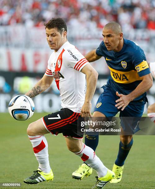Rodrigo Mora of River Plate fights for the ball with Daniel Diaz of Boca Juniors during a match between River Plate and Boca Juniors as part of 24th...