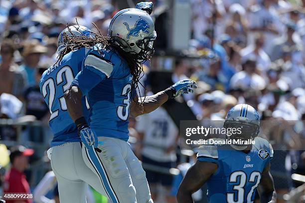 Cornerback Darius Slay celebrates with cornerback Rashean Mathis of the Detroit Lions after Slay intercepted a San Diego Chargers pass at Qualcomm...