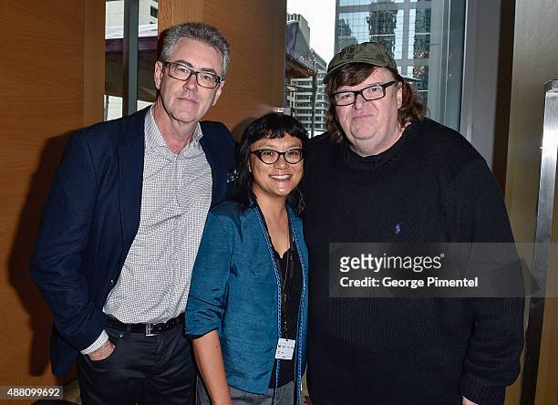 Of the Toronto International Film Festival Piers Handling, filmmaker Mina Shum and director Michael Moore attend the Ebert Tribute Lunch in honour of...