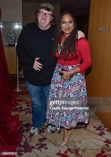 Directors Michael Moore and Ava DuVernay attend the Ebert Tribute Lunch in honour of Ava DuVernay during the 2015 Toronto International Film Festival...