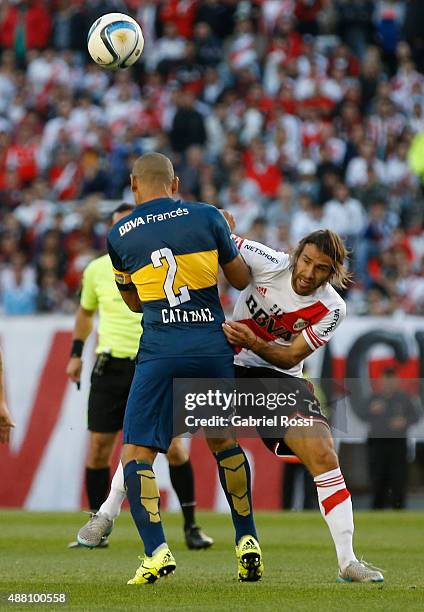 Leonardo Ponzio of River Plate fights for the ball with Daniel Diaz of Boca Juniors during a match between River Plate and Boca Juniors as part of...