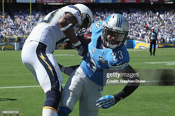Cornerback Darius Slay of the Detroit Lions intercepts a pass intended for wide receiver Malcom Floyd of the San Diego Chargers in the end zone at...