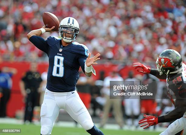 Quarterback Marcus Mariota of the Tennessee Titans throws a twelve yard TD against the Tampa Bay Buccaneers in the first quarter at Raymond James...