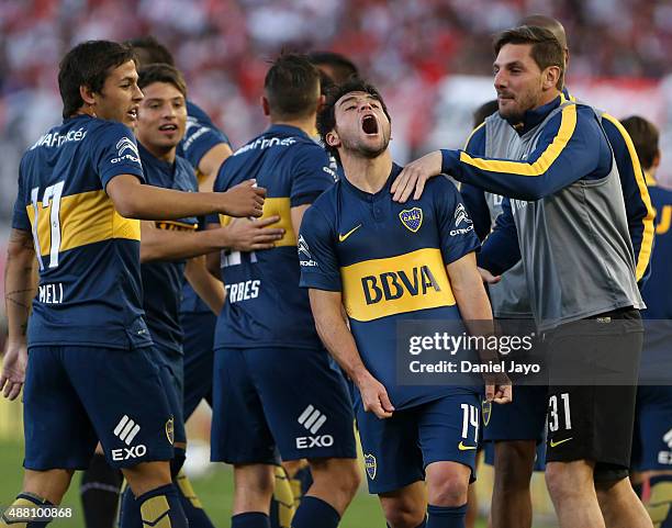 Nicolas Lodeiro, of Boca Juniors, celebrates with teammates after scoring the opening goal during a match between River Plate and Boca Juniors as...