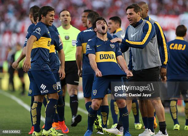 Nicolas Lodeiro, of Boca Juniors, celebrates with teammates after scoring the opening goal during a match between River Plate and Boca Juniors as...