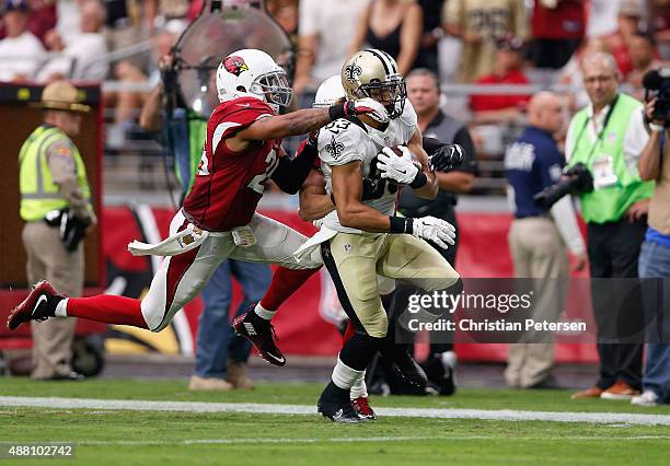 Wide receiver Willie Snead of the New Orleans Saints is hit by free safety Rashad Johnson of the Arizona Cardinals during the third quarter of the...