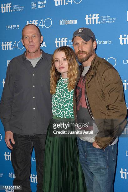 Director/writer Brian Helgeland, actress Emily Browning, and actor Tom Hardy pose during the 'Legend' press conference at TIFF Bell Lightbox on...