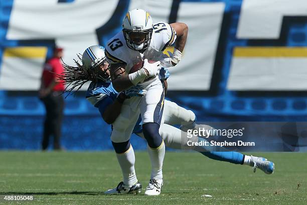 Wide receiver Keenan Allen of the San Diego Chargers is tackled by cornerback Rashean Mathis of the Detroit Lions at Qualcomm Stadium on September...