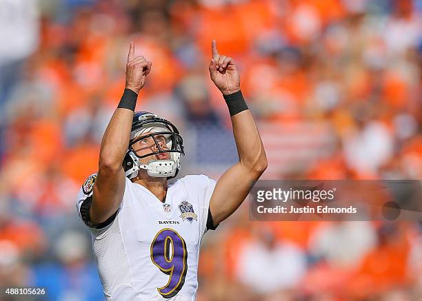 Kicker Justin Tucker of the Baltimore Ravens celebrates after scoring on a 44 yard field goal against the Denver Broncos in the third quarter of a...