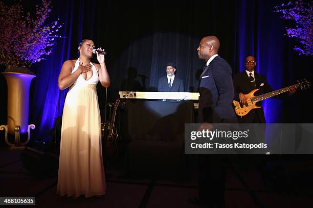 Singers LRenee and KEM perform at the 2014 Steve & Marjorie Harvey Foundation Gala presented by Coca-Cola at the Hilton Chicago on May 3, 2014 in...