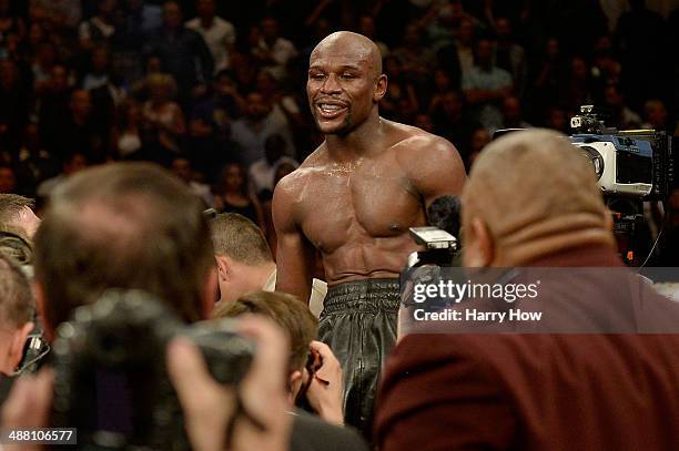 Floyd Mayweather Jr. Celebrates after defeating Marcos Maidana by majority decision in their WBC/WBA welterweight unification fight at the MGM Grand...