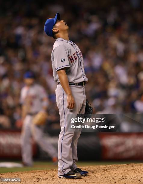 Relief pitcher Daisuke Matsuzaka of the New York Mets reacts as right fielder Curtis Granderson of the New York Mets catches a long fly ball by Drew...