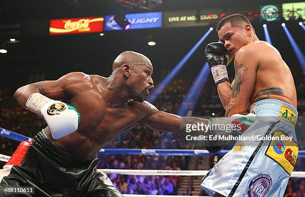 Floyd Mayweather Jr. And Marcos Maidana during their WBA/WBC welterweight unification fight at the MGM Grand Garden Arena on May 3, 2014 in Las...
