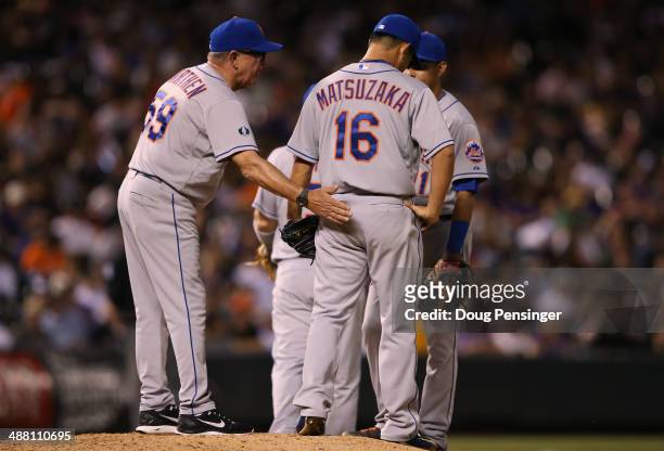 Pitching coach Dan Warthen of the New York Mets visits the mound to check on relief pitcher Daisuke Matsuzaka of the New York Mets as he works...