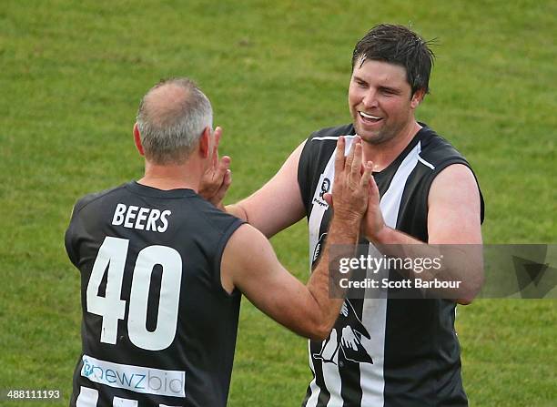 Leigh Brown of the Pies Legends celebrates after kicking a long range goal during the match between the Navy Blues and the Pies Legends at Visy Park...