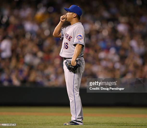 Relief pitcher Daisuke Matsuzaka of the New York Mets works against the Colorado Rockies at Coors Field on May 3, 2014 in Denver, Colorado. The...