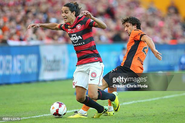 Jerome Polenz of the Wanderers and Thomas Broich of the Roar compete for the ball during the 2014 A-League Grand Final match between the Brisbane...